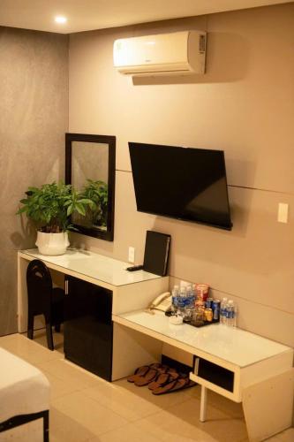 an office with a desk with a computer on a wall at Ngoc Se Hotel in Pleiku
