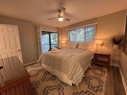 a bedroom with a bed with a stuffed animal on it at Hideaway in Southport