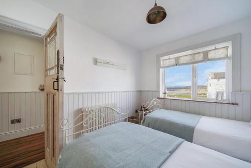 Ένα ή περισσότερα κρεβάτια σε δωμάτιο στο Susans Beach House