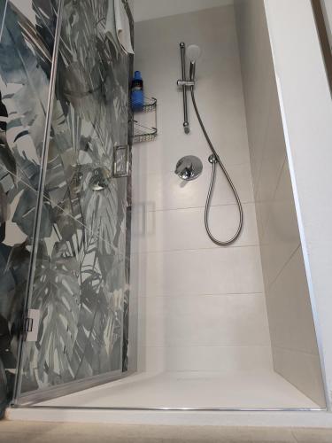 a shower with a shower head in a bathroom at 33 Joy Dreams in Sandra
