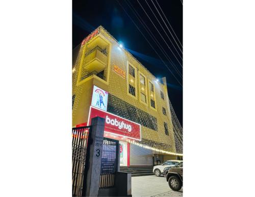 a building with a sign on the side of it at Hotel shree ji inn in Kishangarh