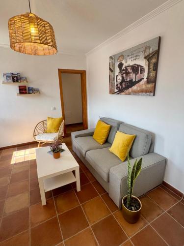 a living room with a couch and a table at Casa Millo in Tarajalejo