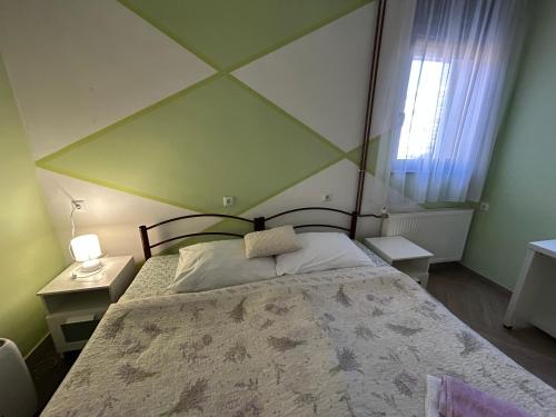 Postel nebo postele na pokoji v ubytování Apartments & Rooms 4 rijeke