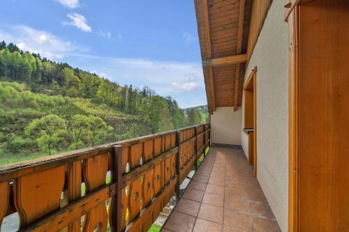 a balcony with a view of the mountains at Chalupa Pod Studánkou in Petříkovice