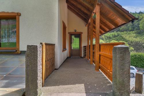 a porch of a house with a wooden fence at Chalupa Pod Studánkou in Petříkovice