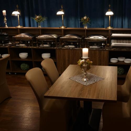 a wooden table with a vase of flowers on it at Hotel Mieszko in Gorzów Wielkopolski