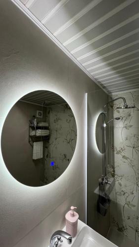 a bathroom with a sink and a mirror at Hana Apartment Ohrid in Ohrid