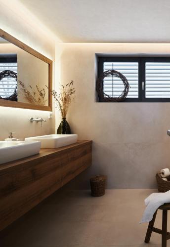a bathroom with a white sink and a mirror at Chalupa Nadohled in Červený Potok