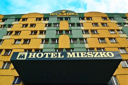 a hotel mitzvaso building with a sign in front of it at Hotel Mieszko in Gorzów Wielkopolski