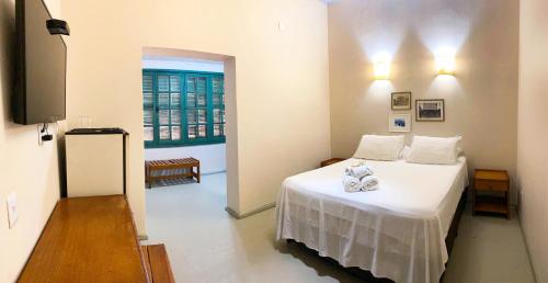 Ένα ή περισσότερα κρεβάτια σε δωμάτιο στο Portal Pantaneiro Hotel