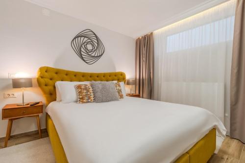 Ένα ή περισσότερα κρεβάτια σε δωμάτιο στο Dozsa Residence