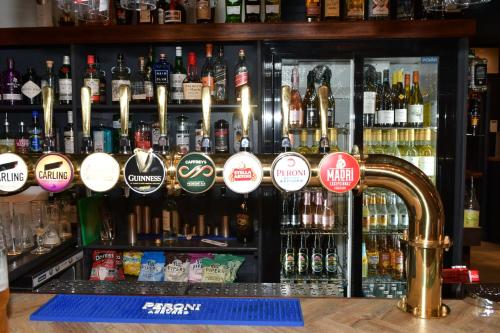 a bar with a lot of bottles of alcohol at The SOLO No 1 Bank Chambers in Sleaford