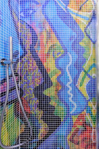 a shower curtain with a map of the world at La Madegra Seasuite in Salerno