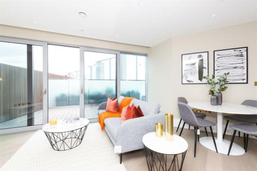 a living room with a couch and a table at Greenwich O2 in London