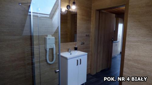 a bathroom with a sink and a mirror at Agroturystyka Katarzyna in Święta Katarzyna
