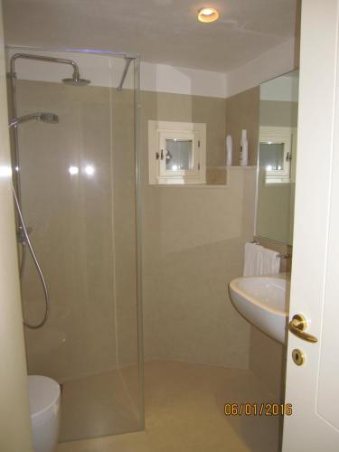 a bathroom with a shower and a sink at Sax Barisano in Matera