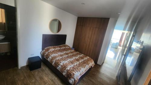 Кровать или кровати в номере Departamento exclusivo ica