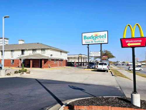 a sign for a burger king on a street at Budgetel inn & Suites in Fort Scott