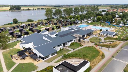 an aerial rendering of a resort with a pool at Kompas Camping Nieuwpoort in Nieuwpoort