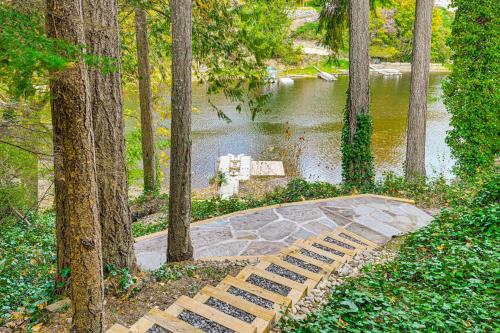 a park with a bench in the middle of a pond at Pet-Friendly Studio with Fire Pit in Olympia! in Olympia