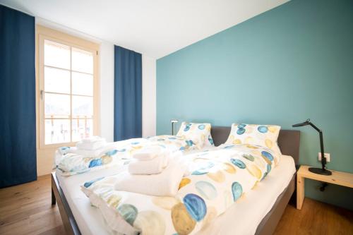 Una cama o camas en una habitación de Chasa Muntanella