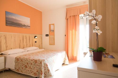 Postel nebo postele na pokoji v ubytování Hotel Saint Tropez - Pineto