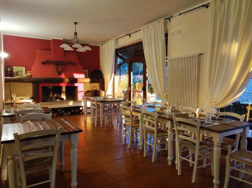 a dining room with wooden tables and chairs at Agriturismo Podere S. Croce in Saturnia