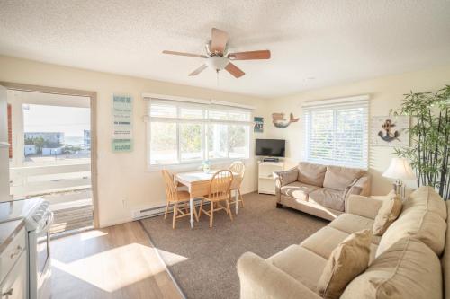 a living room with a couch and a table at Montauk Oceanside Suites in Montauk