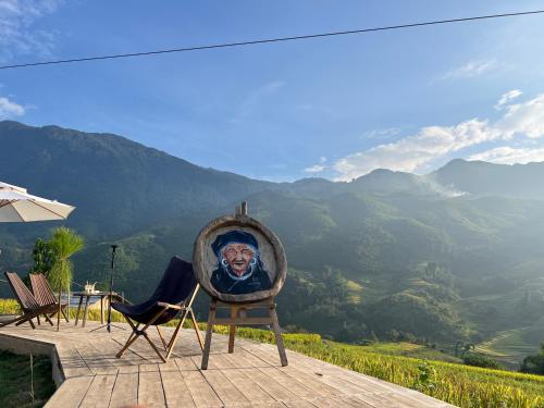 a chair with a picture of a man on it at Pavi garden in Sa Pa