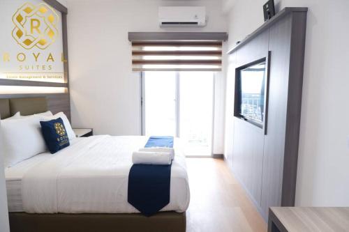 Ένα ή περισσότερα κρεβάτια σε δωμάτιο στο Royal Suites Studio 26QY - Citra Plaza Nagoya