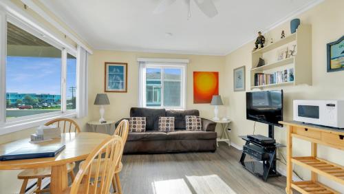 a living room with a couch and a table at Montauk Oceanside Suites in Montauk