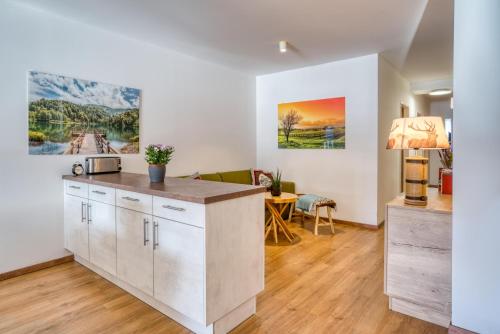 Kuchyň nebo kuchyňský kout v ubytování COOEE alpin Hotel Dachstein