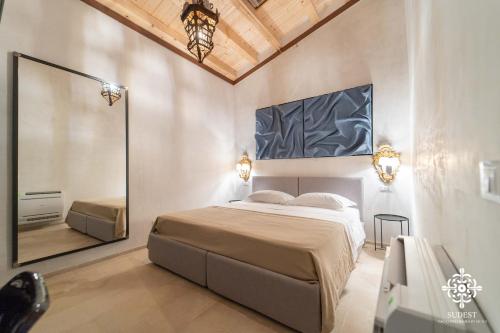 Postel nebo postele na pokoji v ubytování Casa Philomena - Noto Design Rooms