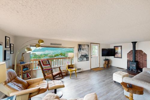 a living room with a couch and a fireplace at Whale Watch in Lincoln City