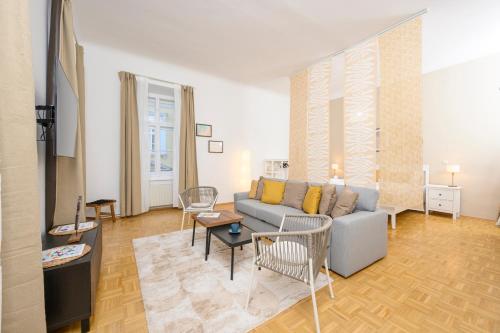 a living room with a couch and a table at Spacious apartment in Graz for 6 people in Graz