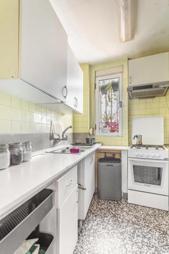 a kitchen with white appliances and a window at Golden Moor accommodation in Tamworth