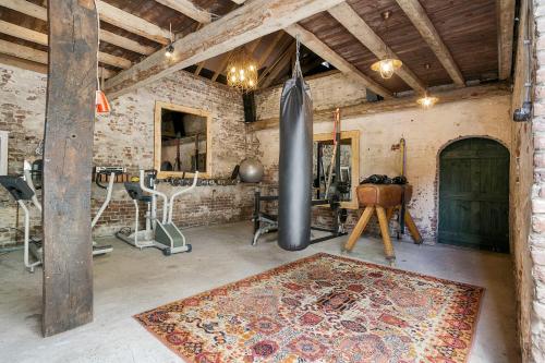 a room with a gym with a inflatable at B&B De Grote Waaij in Well