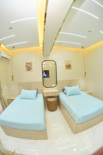 Ένα ή περισσότερα κρεβάτια σε δωμάτιο στο Sheikh Zayed home
