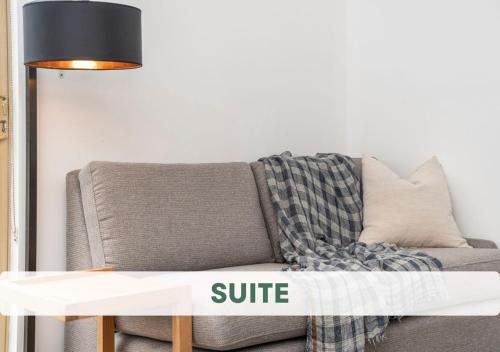 a living room with a couch and a table at The Swan Valley Hotel in Henley Brook