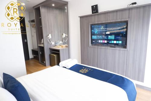 a hospital room with a bed and a tv at Royal Suites Studio 26RU - Citra Plaza Nagoya in Jodoh