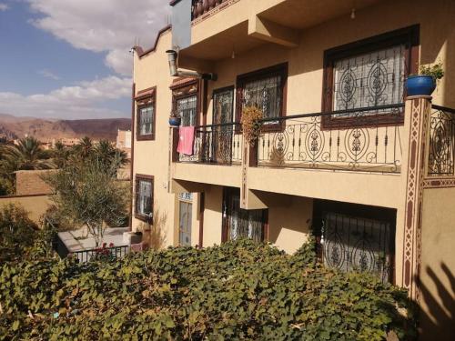 a building with balconies and a view of the desert at Dar Latifa in Tinerhir