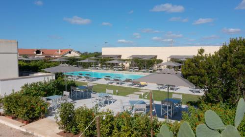 a view of a resort with a swimming pool at Delle Rose, Hotel & Horse Riding in Torre Vado