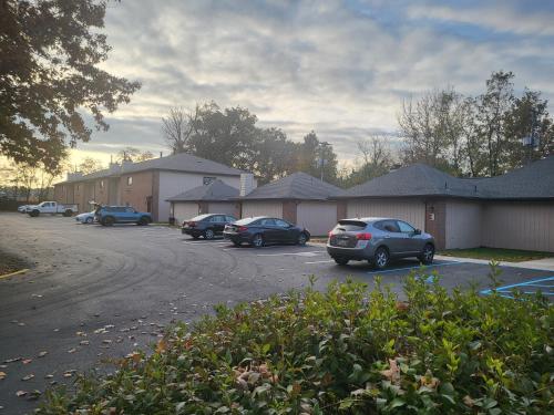 a group of cars parked in a parking lot at Inn of the Dove - Romantic Luxury Suites with Jacuzzi & Seasonal Fireplace at Harrisburg-Hershey-Philadelphia, PA in Harrisburg