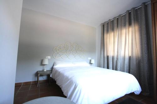 Ένα ή περισσότερα κρεβάτια σε δωμάτιο στο Apart-Hotel Selva Nevada