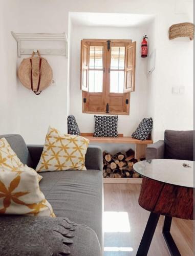 a living room with a couch and a table at La Casita Tipica in Zuheros