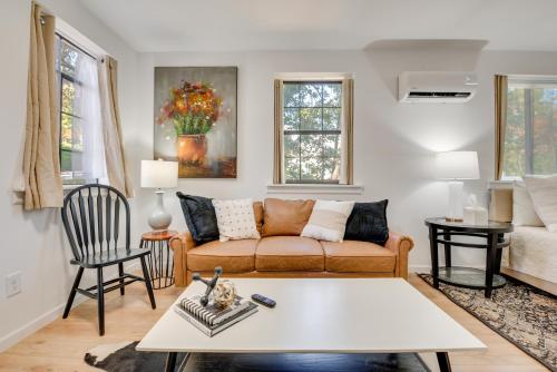 a living room with a couch and a table at Private Porch! Cozy East ATL Stay Near World Cup in Atlanta