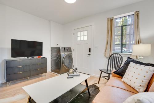 a living room with a couch and a tv at Private Porch! Cozy East ATL Stay Near World Cup in Atlanta