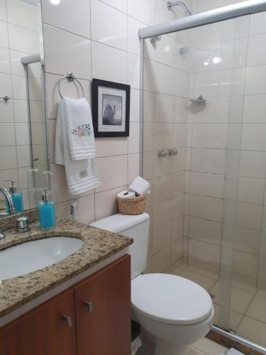 a bathroom with a shower and a toilet and a sink at Lapinha 40 Graus Studio in Rio de Janeiro