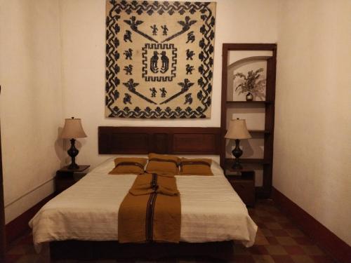Una cama o camas en una habitación de Hotel Casa Chapultepec