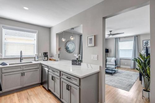 a kitchen with a sink and a counter top at Chic Waterfront Apartment in Downtown San Marco in Jacksonville